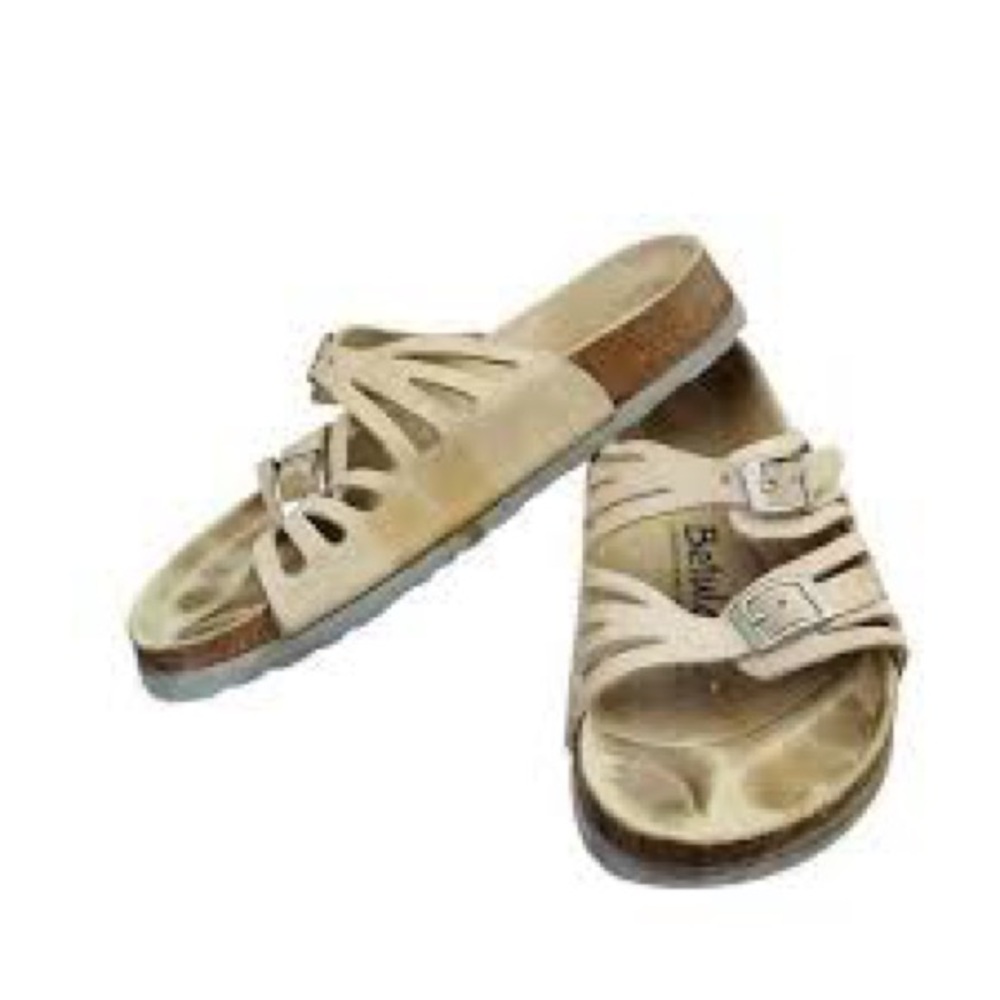 White Birkenstock Granada soft footbed sandals with adjustable buckle straps.